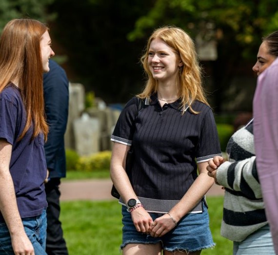 First-year students participate in the Welcome Walk during Orientation Weekend.